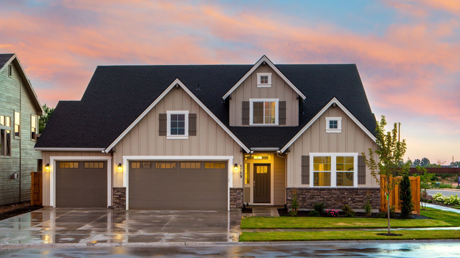 A typical suburban home at dusk — the kind of house whose rebuild cost can quietly outgrow an older policy